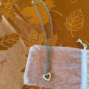 Swarovski crystal heart necklace on thick chain 18l length, good condition.